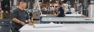 Cushing's production team working in the print shop