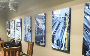 ROW OF BRANDED CANVAS PRINTS AT PROCESS TECHNOLOGIES