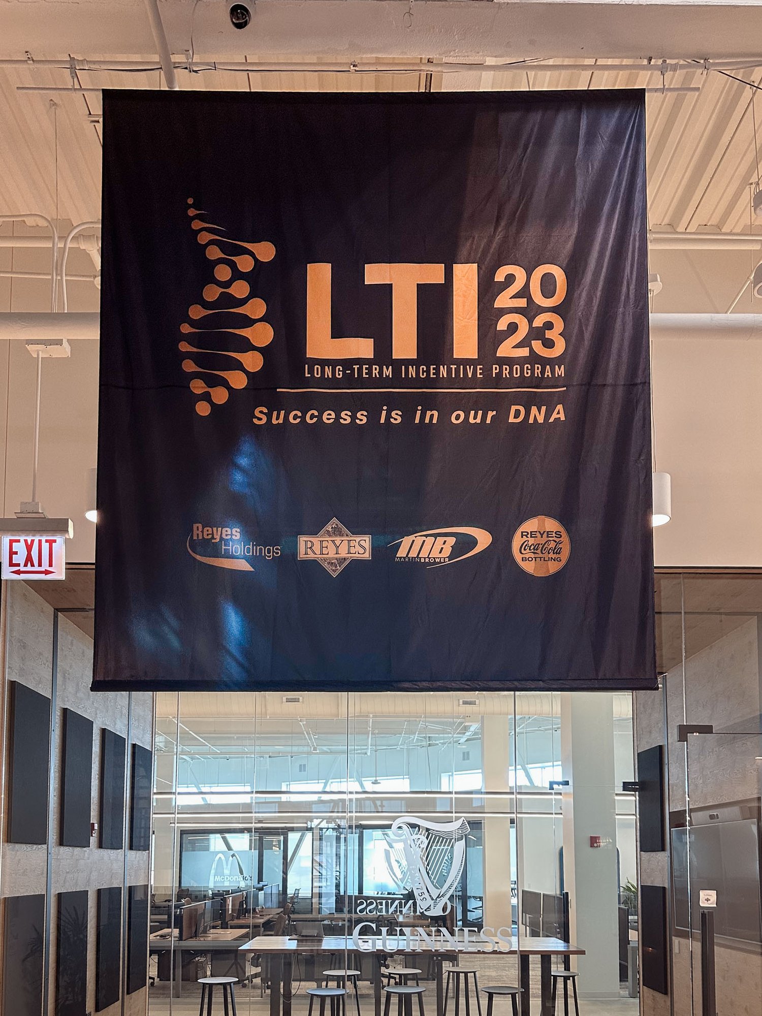 Hanging banner for Reyes' LTI 2023 Long-Term Initiative Program, featuring bold branding and clear event messaging