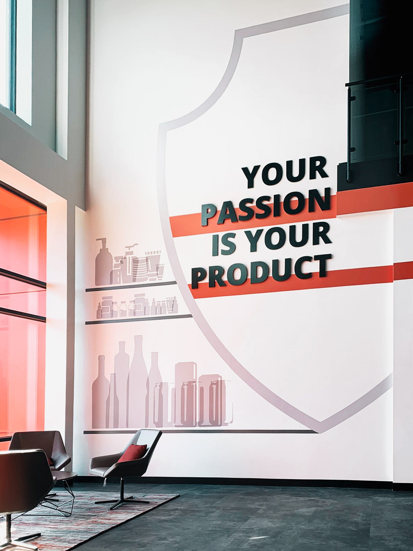 Dimensional signage and vinyl graphics create a branded workspace at Signode's headquarters lobby.