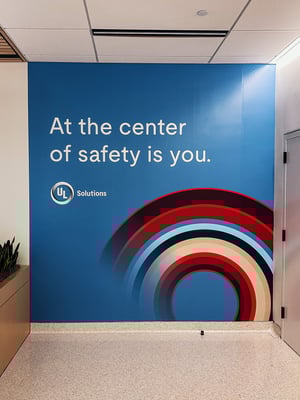 Wall Graphic in an office that reads 
