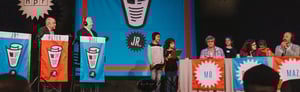 Large banners on stage at an NPR stage show