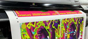 colorful matte poster print coming off printer